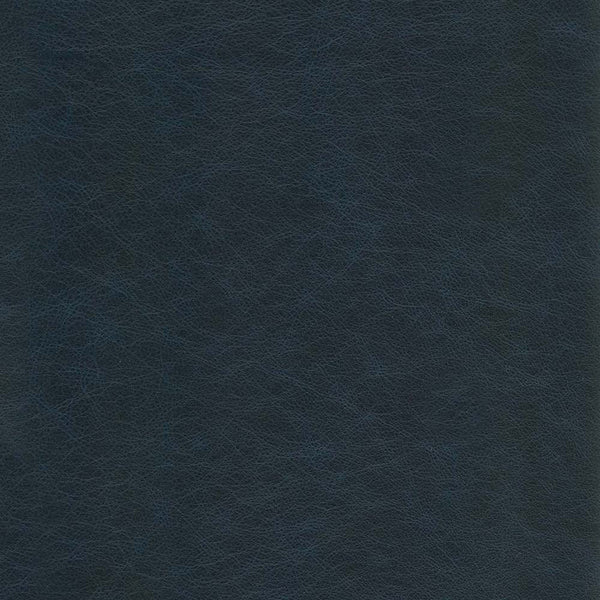 A close-up of a dark navy blue textured material, resembling leather or faux leather with a fine grain pattern.