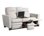 Beige reclining sofa with a laptop on an adjustable tray table on a white background