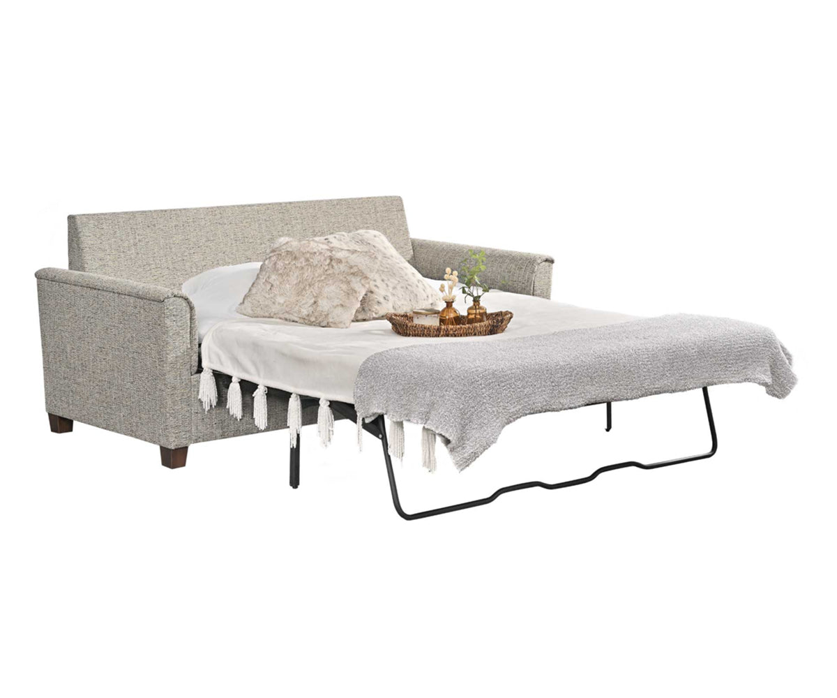 Baltimore sleeper sofa opened with mattress and bedspread. 