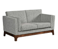 Love seat with two seats and gray fabric.