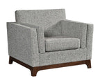Arm chair in grey fabric on white background.