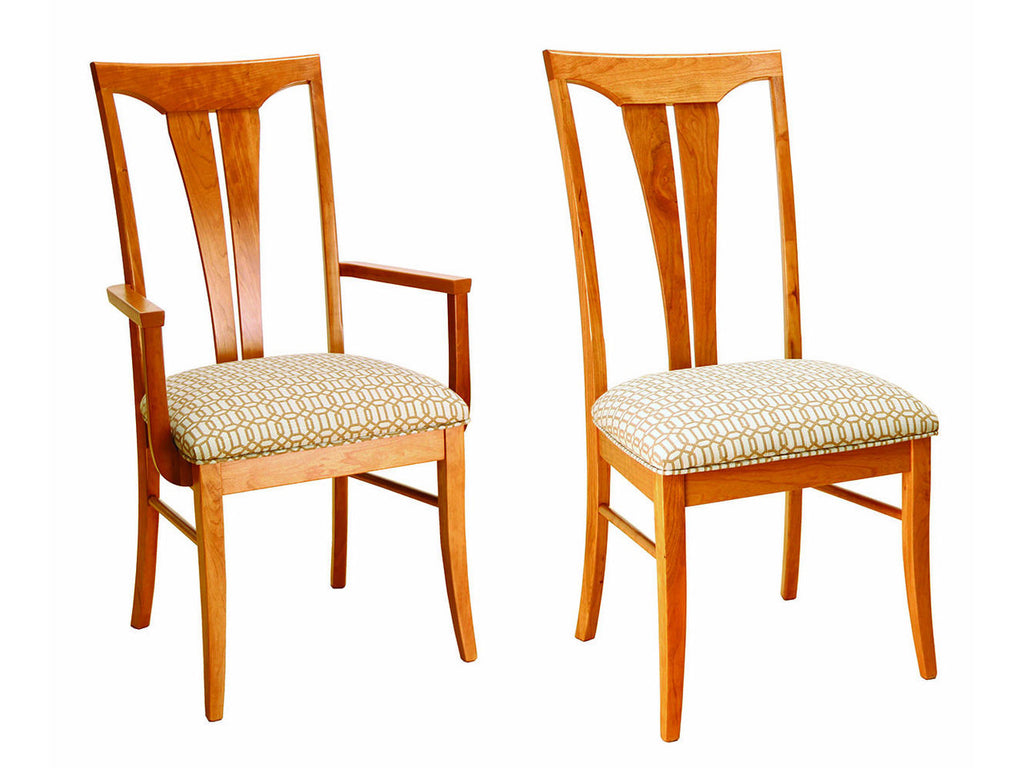Two wooden chairs with patterned cushions on a white background