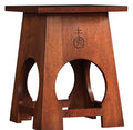 Wooden table with a central cutout design.