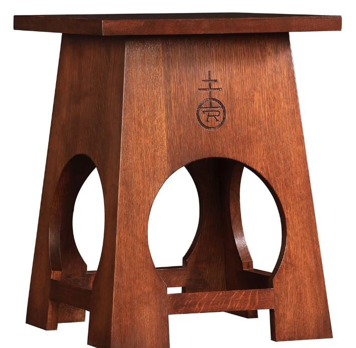 Wooden table with a central cutout design.