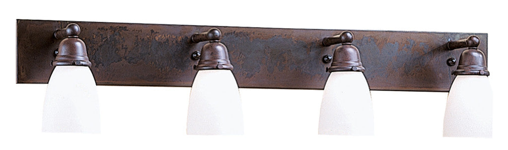 Bathroom light fixture with three glass shades on a dark metal frame.