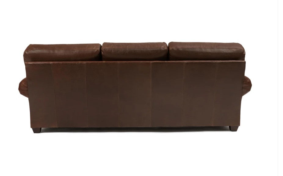 A brown leather three-seater sofa shown from the back, featuring three back cushions and rolled armrests, set against a plain white background.