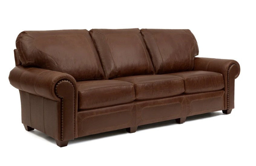 A three-seater brown leather sofa with rolled arms, nailhead trim, and a deep seat cushion, shown on a plain white background.
