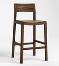 A modern wooden bar stool with a dark brown wood frame, a square backrest, and a light beige seat cushion, shown against a plain white studio background.