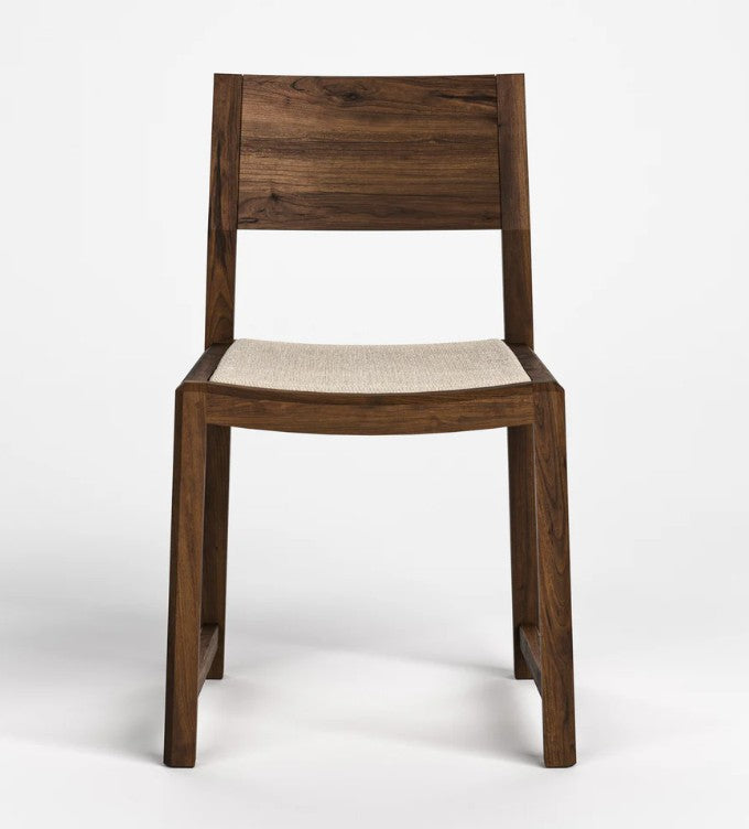 A modern wooden dining chair with a dark brown wood frame and a light beige woven seat, shown against a plain white studio background.