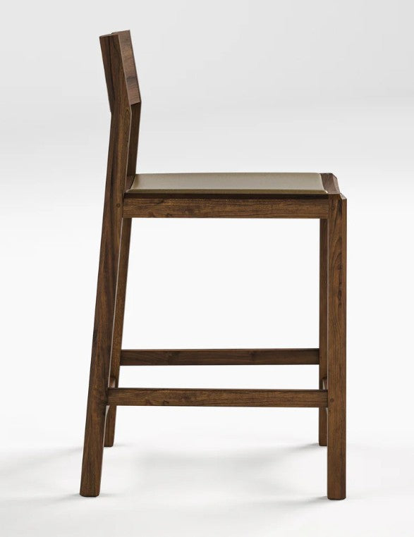 A modern wooden barstool with a dark brown frame, a light beige seat cushion, and a tall integrated backrest, shown from a side angle on a light gray background.