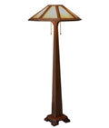 Tall floor lamp with a decorative shade on a white background