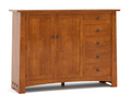 A warm medium-brown wooden sideboard cabinet with two paneled doors and four drawers on the right, featuring small dark metal knobs and decorative corner brackets, shown on a white background.