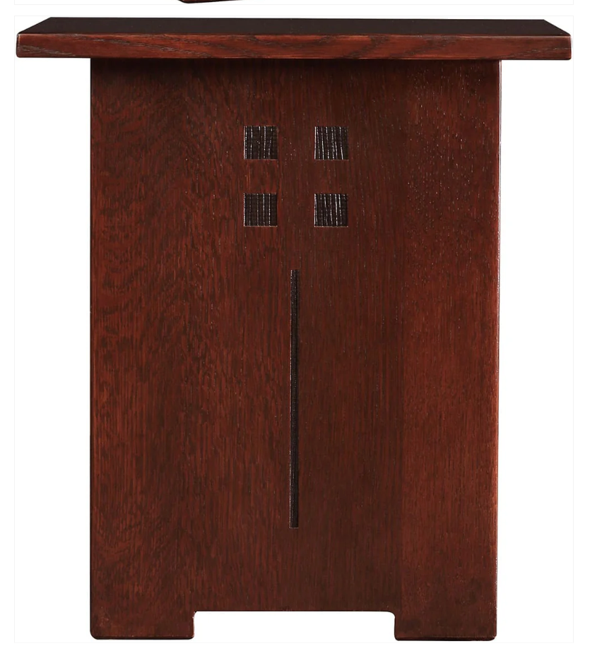 A dark reddish-brown wooden cabinet or side table with a flat rectangular top, vertical front panel, decorative inset panels near the top, and a central vertical handle recess, shown against a plain white background.