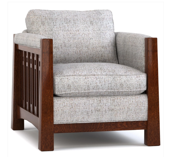 A classic armchair with a textured light gray fabric upholstery and a dark brown wooden frame featuring a decorative slatted side panel.