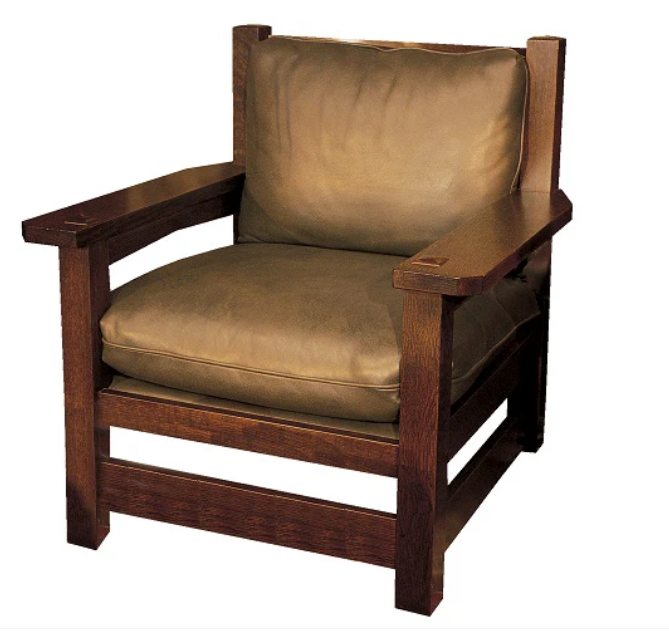 A wooden armchair with a dark brown frame and thick tan cushions, shown against a plain white background.