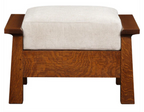 A wooden bench with a thick, square, light beige upholstered cushion on a rich brown wood frame, shown against a plain white background.