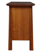 A mid-century modern wooden side table or end table with a warm medium-brown wood finish, featuring a thick rectangular top, straight legs, and a recessed panel on the front, shown against a plain white background.