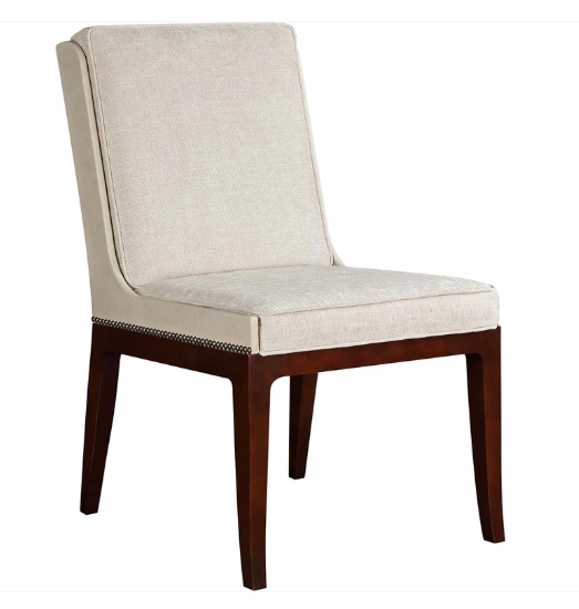 An upholstered dining chair with a high back, light beige textured fabric seat and backrest, and dark brown wooden legs with a silver nailhead trim, shown on a plain white background.