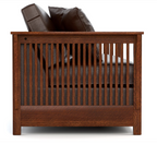 A wooden daybed or sofa frame with vertical slats, shown from the front on a white background. The frame is made of medium-to-dark brown wood, and dark brown leather cushions are visible inside.