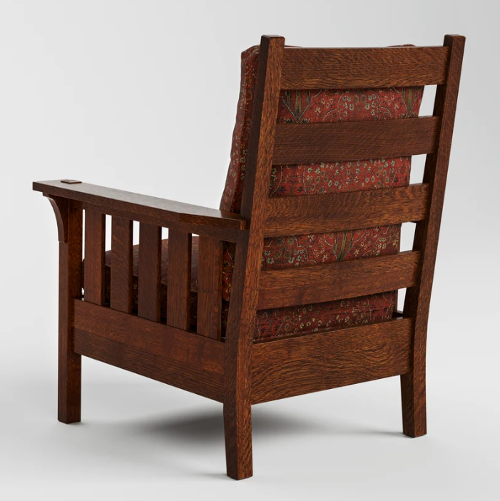 A classic wooden armchair with a dark reddish-brown oak frame and red floral patterned fabric cushions, shown from a three-quarters angle on a light gray background.