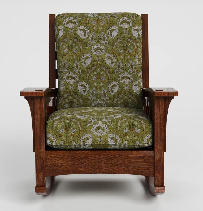 A wooden rocking chair with a dark brown wood frame and green damask patterned upholstery, shown against a light gray background.