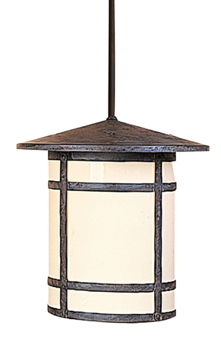 A hanging pendant light fixture with a dark textured metal frame and a warm cream-colored cylindrical shade, suspended by a dark rod against a plain white background.