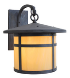 A single outdoor wall sconce with a dark metal frame and a warm yellow-orange frosted glass shade, shown against a plain white background.