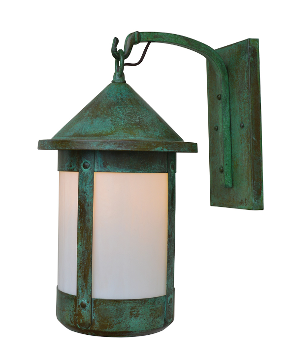 A vintage-style outdoor wall sconce with a distressed green and bronze metal body, featuring two frosted white glass panels on a white background.