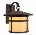 A rustic outdoor wall sconce with a dark bronze metal frame and a warm yellow glowing glass shade, shown against a plain white background.