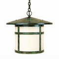 A hanging outdoor lantern light with a distressed green and bronze metal frame and a cream-colored glass shade, suspended by a chain against a plain white background.