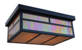 A modern rectangular ceiling light fixture with a black metal frame and iridescent glass panels that shift between pink, green, and yellow, with warm orange light glowing from within.