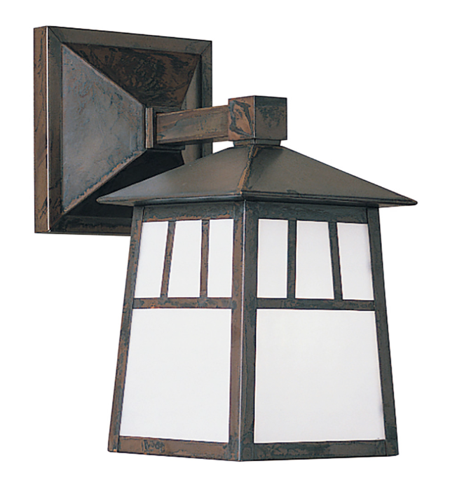 Decorative outdoor wall light fixture with metal frame and glass panels on a white background