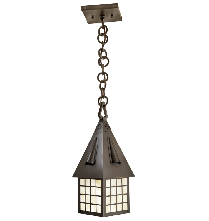 A hanging pendant light fixture with a dark bronze metal frame, featuring a pointed roof-like shade and a grid of warm white glass panels, suspended by a chain from a square ceiling mount against a white background.