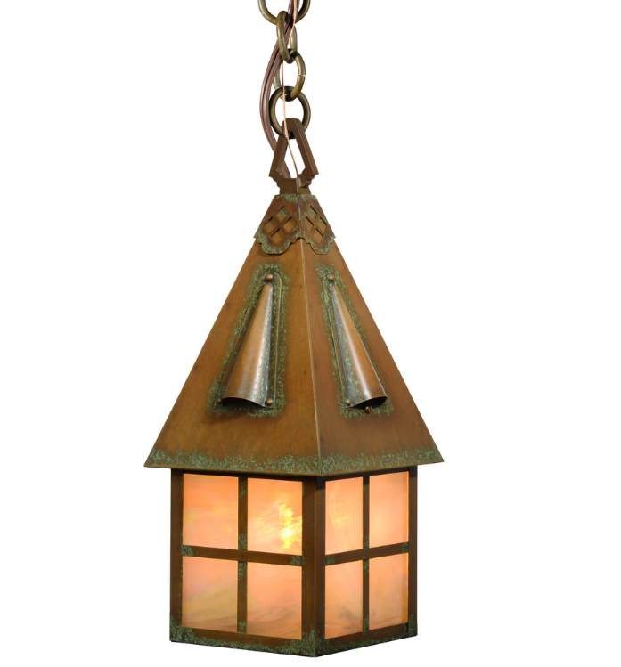A hanging lantern-style light fixture with a copper-toned metal body, decorative roof details, and warm amber-tinted glass panels, shown against a plain white background.