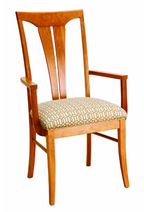 A wooden dining chair with a warm medium-brown frame and a patterned beige cushion on a white background.
