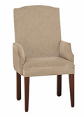 A high-back upholstered dining chair with a beige fabric seat and backrest, curved armrests, and dark brown wooden legs, shown against a plain white background.