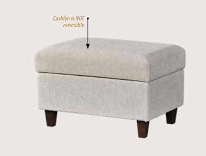 A light beige upholstered storage ottoman with dark wooden legs, shown on a plain light background with an arrow and text reading 'Cushion is NOT reversible'.