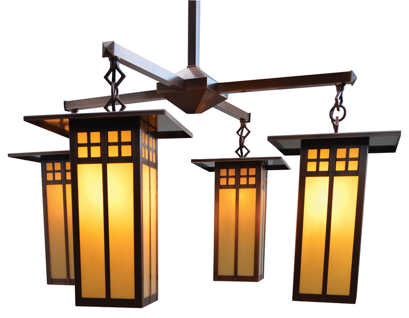 Chandelier with three illuminated glass shades on a white background
