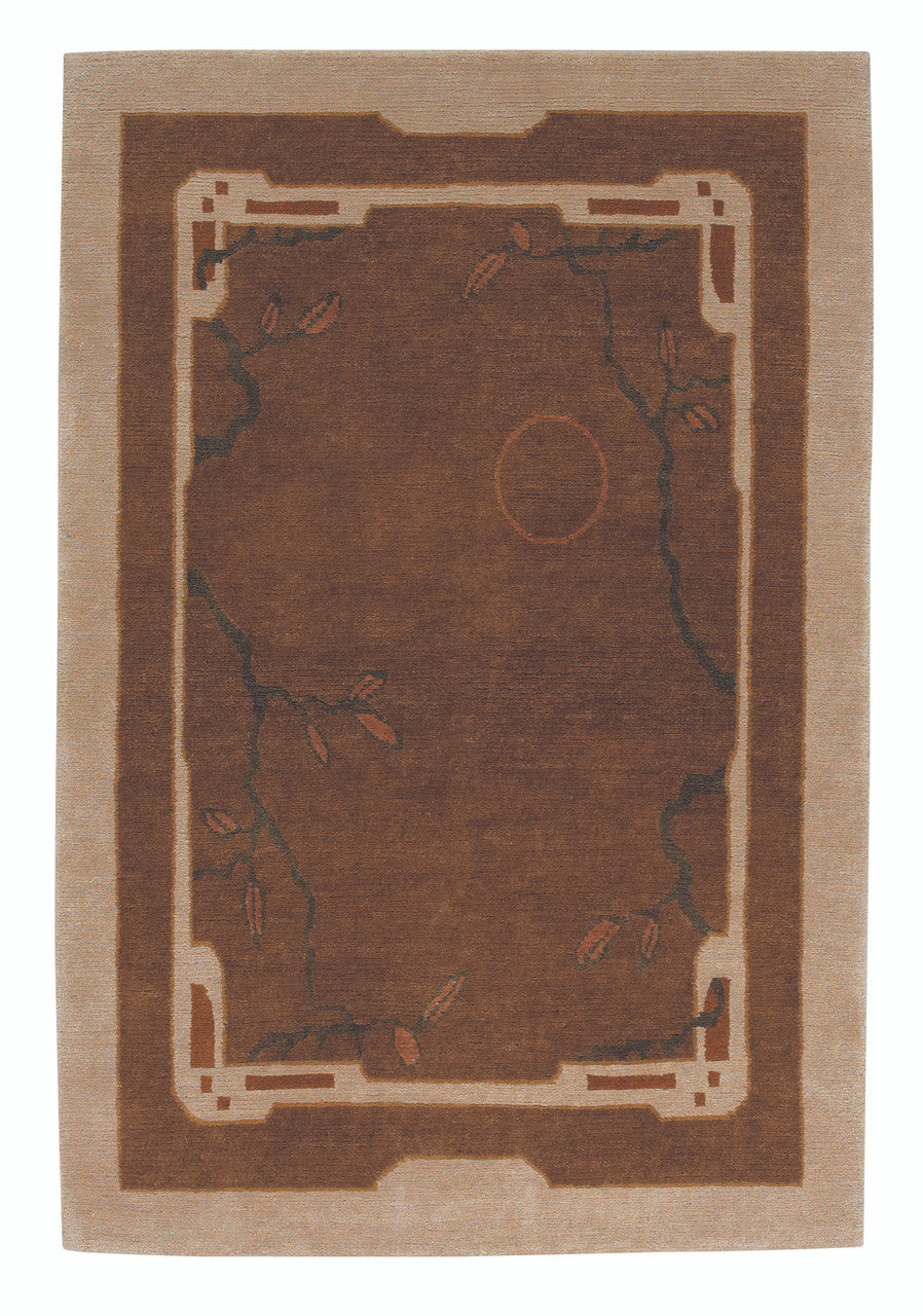 Brown and beige area rug with decorative border