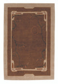 Brown and beige area rug with decorative border