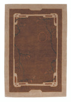 Brown and beige area rug with decorative border