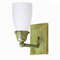 A wall-mounted sconce light fixture with a frosted white glass shade and an antiqued brass or bronze metal mount, shown against a plain white background. A small 'Made with AI' label appears in the top right corner.