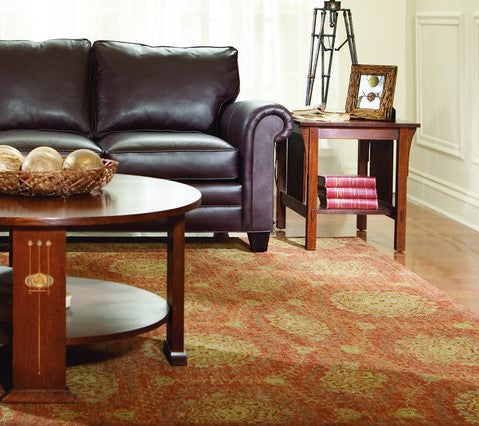 Living room with brown leather sofa, wooden coffee table, and side table.