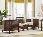 Wooden furniture set with white cushions in a room with yellow walls, large windows, and a gong