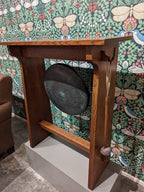 Gong on a wooden stand.