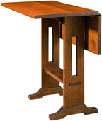 Wooden drop-leaf table on a white background. 