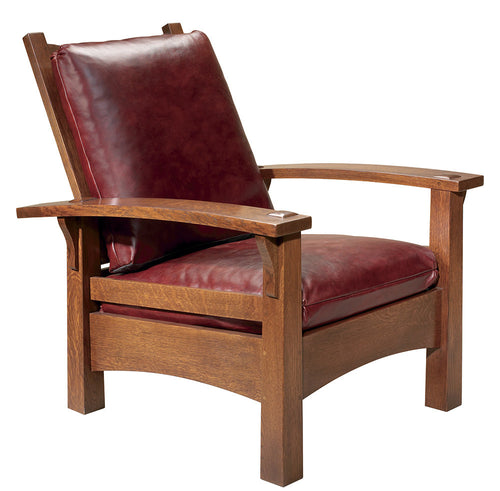 Wooden armchair with red leather cushions on a white background