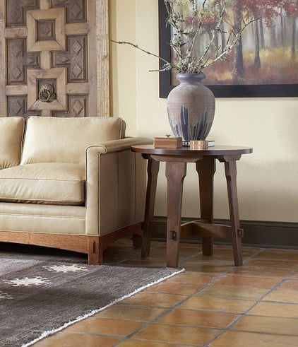 Living room with beige sofa, wooden side table, and decorative elements.