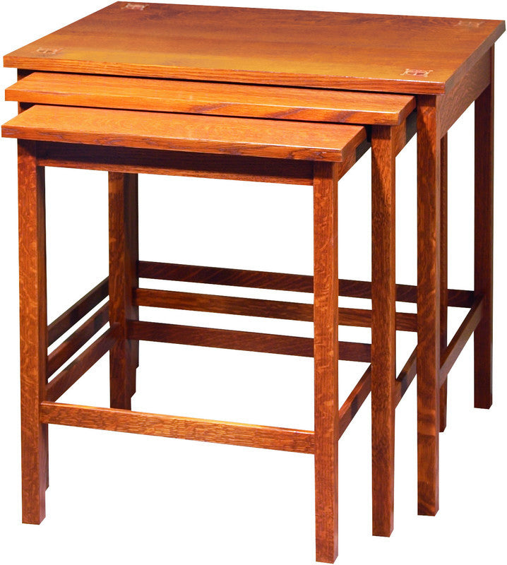Set of three wooden nesting tables on a white background