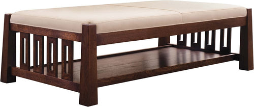 Wooden cocktail table and ottoman with beige cushion on a white background.